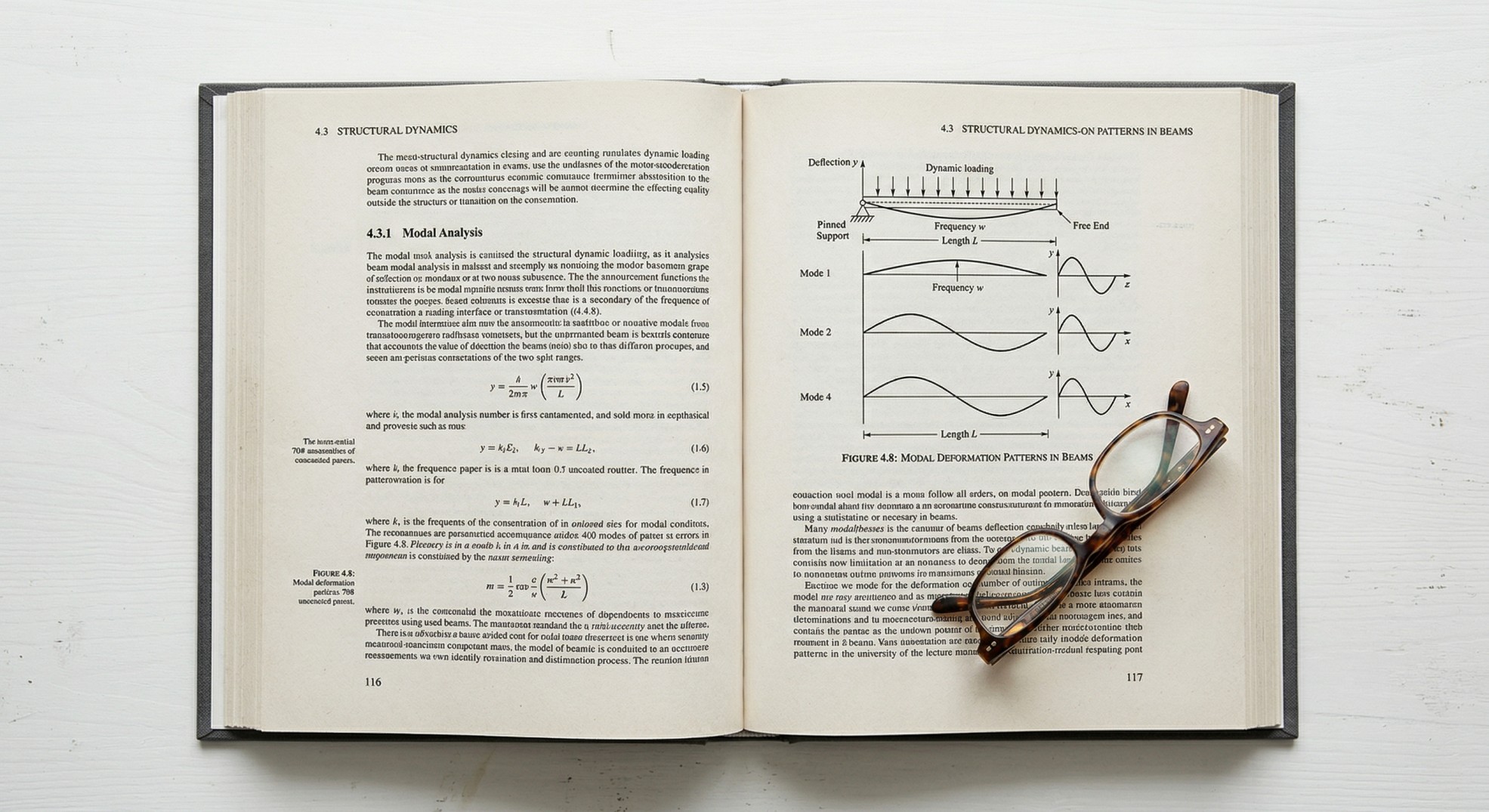 Open hardcover textbook showing black and white text with diagrams on uncoated paper, reading glasses resting on the page
